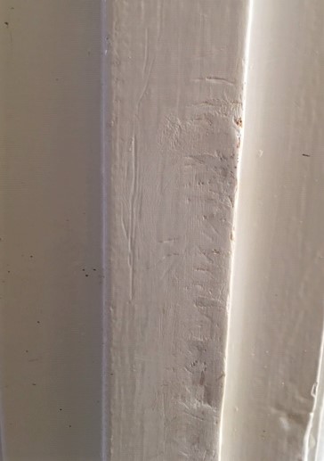 door frame scratched by dog